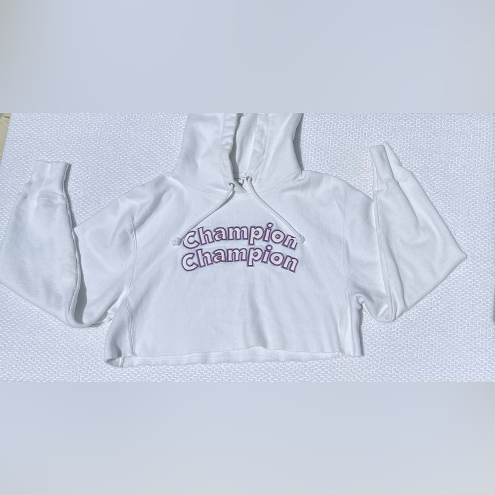 A heavy white cropped champion hoodie